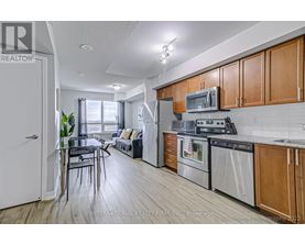 A kitchen with wooden cabinets and stainless steel appliances.