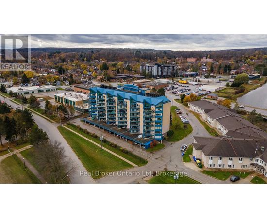 A real estate company's brochure featuring a photograph of a residential area with apartment buildings and houses.