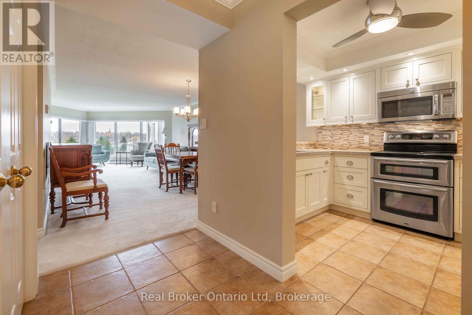 A kitchen with a stove top oven and microwave above it.