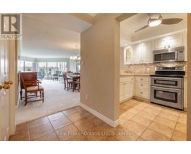 A kitchen with a stove top oven and microwave above it.