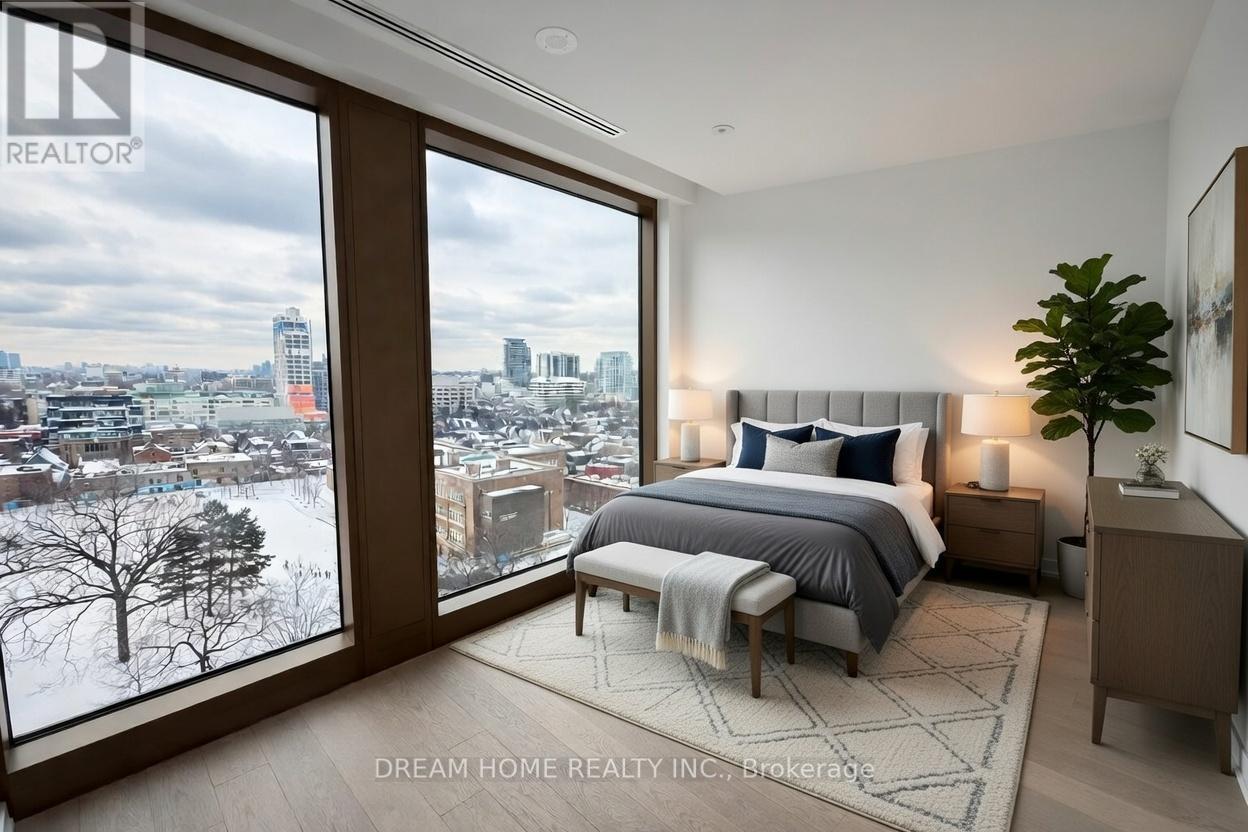 A bedroom with a large bed and a view of the city through the window.