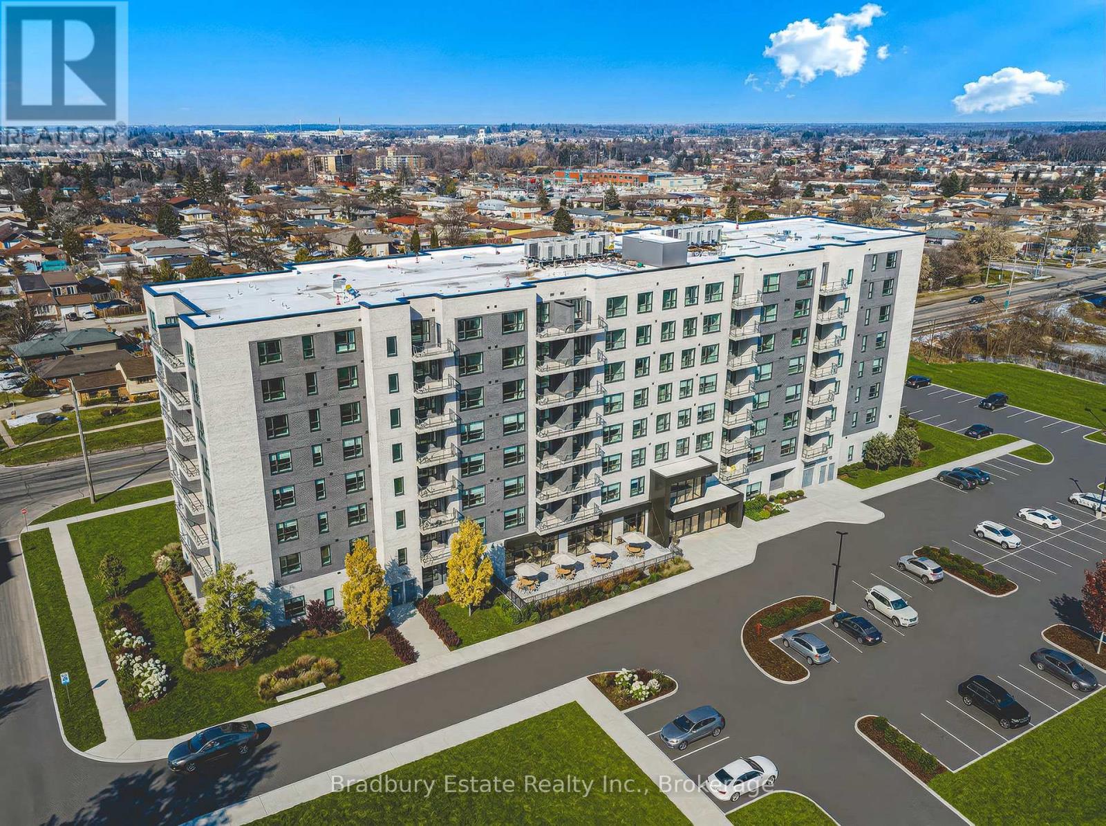 A Bradbury Estate Realty Inc. sign is visible on a building in the distance.
