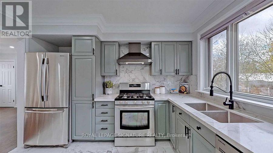 A kitchen with a stove top oven and a refrigerator.