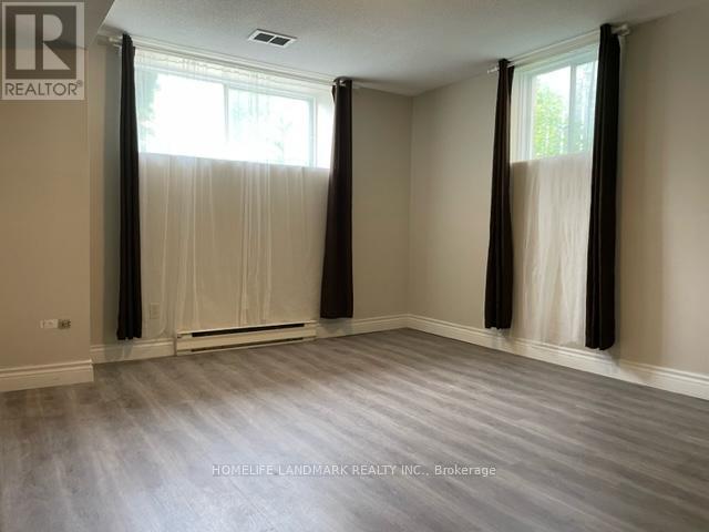 A room with a window and curtains is for sale.