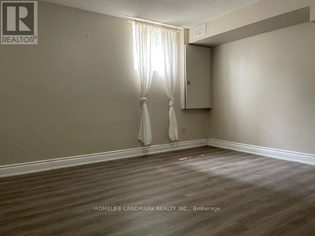A room with a window and a curtain.