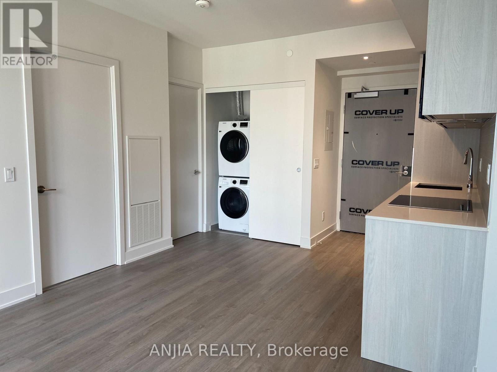 A modern kitchen with a dishwasher and a washing machine.