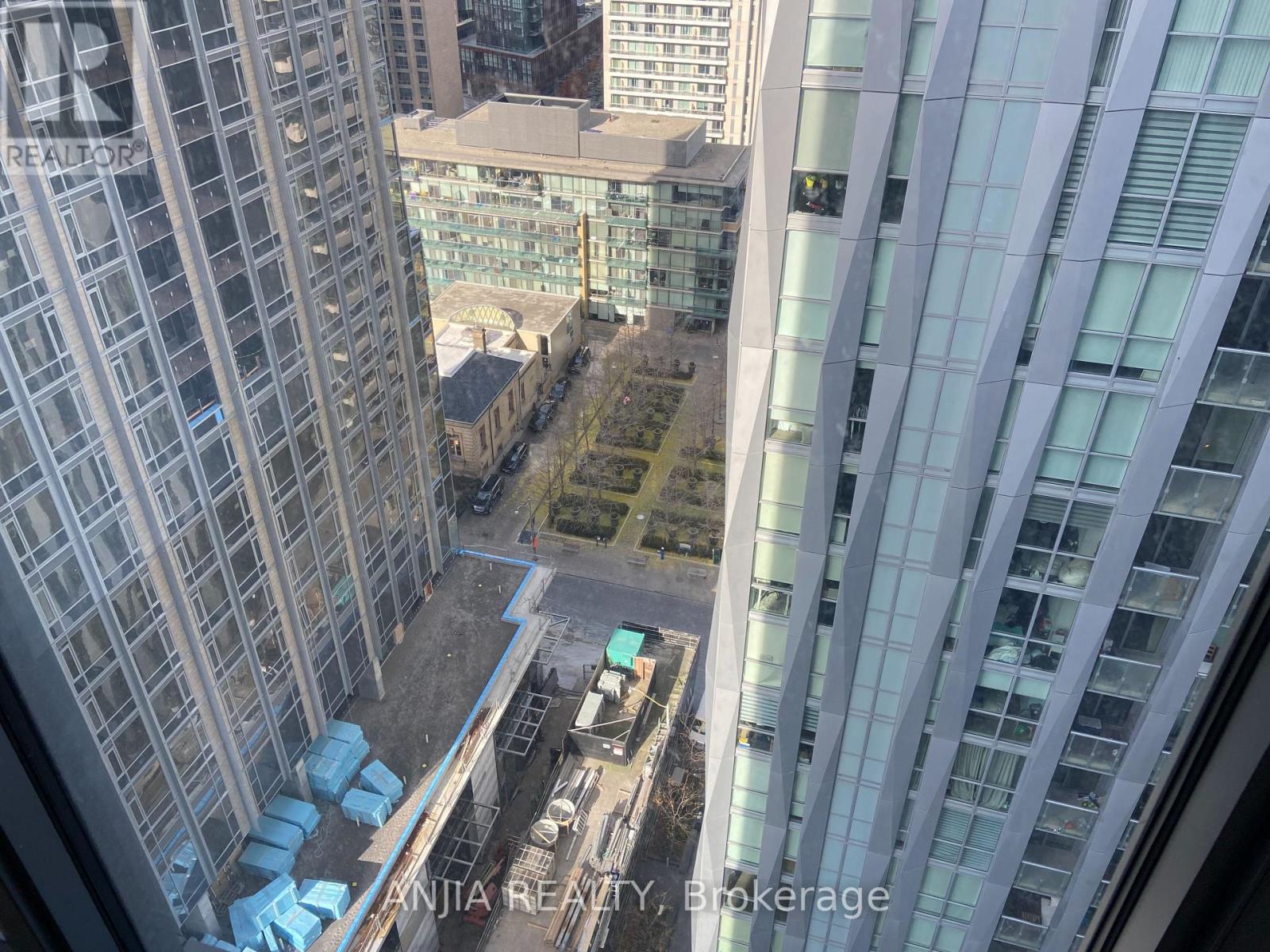 A view from a high-rise building looking down at a construction site.