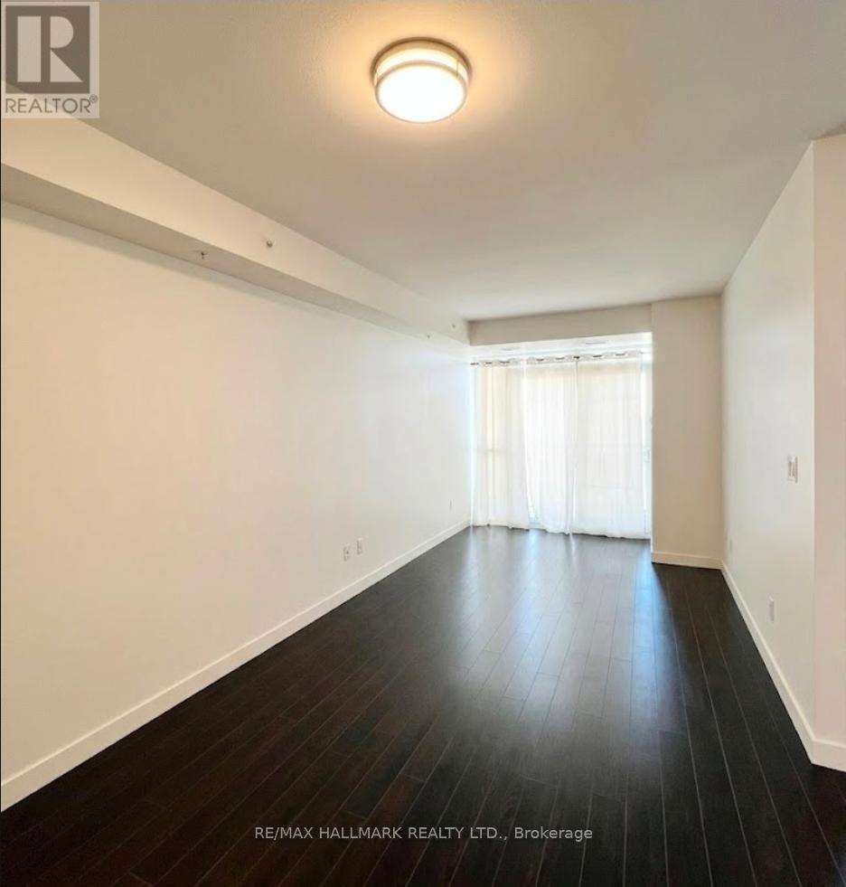 A room with wooden floors and white walls.