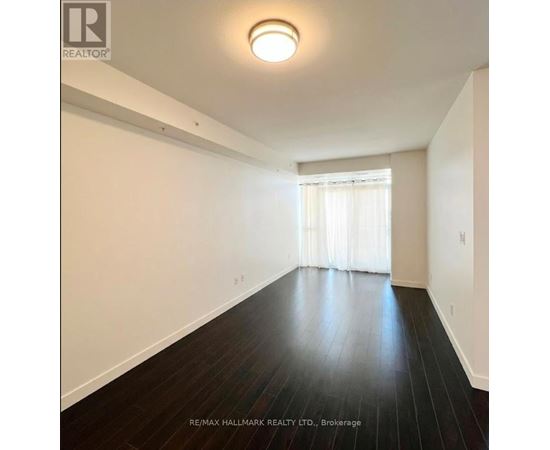 A room with wooden floors and white walls.