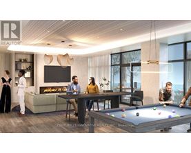 A group of people are gathered in a modern living room with a pool table.