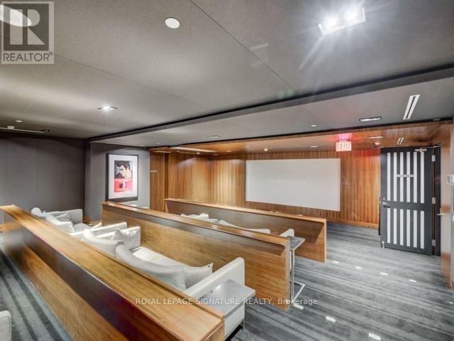 A conference room with a long table and chairs.
