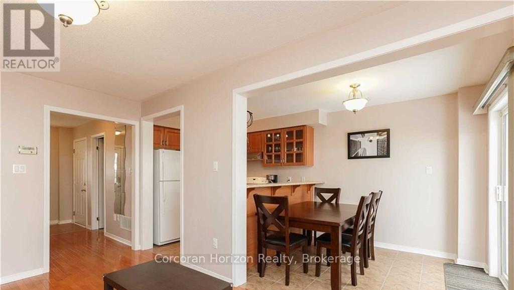 A realtor photo of a dining room with a table and chairs.