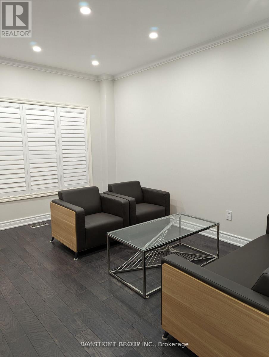 A living room with a couch, chair, and coffee table.