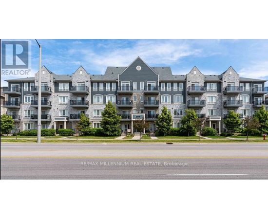 A large, modern apartment building with multiple balconies and a well-maintained lawn in front.