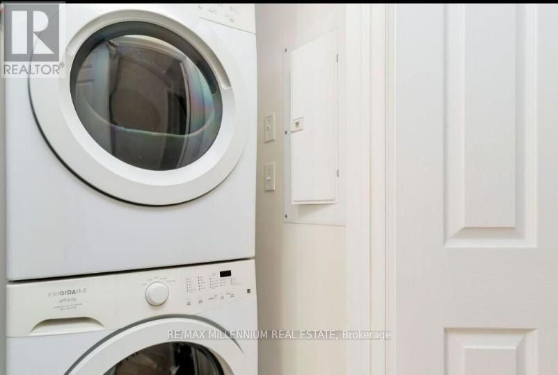 A white washing machine with the door open.