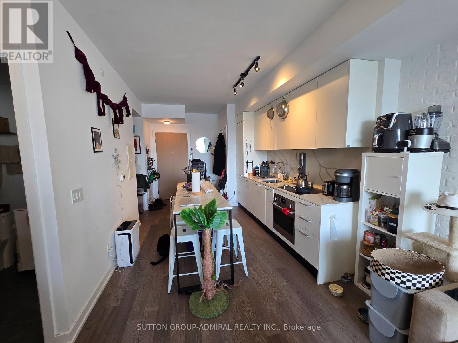 A kitchen with a table and chairs in the middle of it.