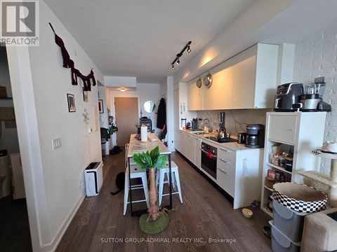 A kitchen with a table and chairs in the middle of it.