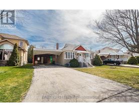 A house with a driveway in front of it.