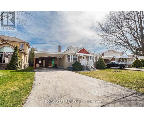 A house with a driveway in front of it.