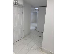 A white door is on the left and a white wall is on the right.