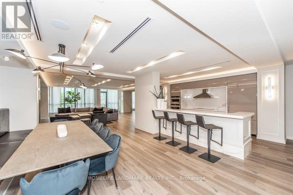 A modern dining room with a long table and chairs.