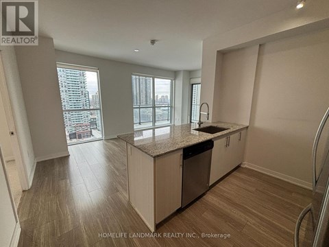 A kitchen with a countertop and cabinets is shown in this image.