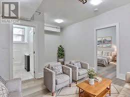 A living room with a couch, chair, and coffee table.