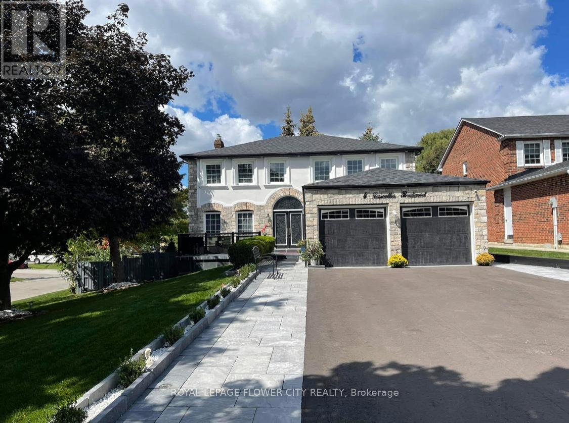 A large house with a driveway in front of it.