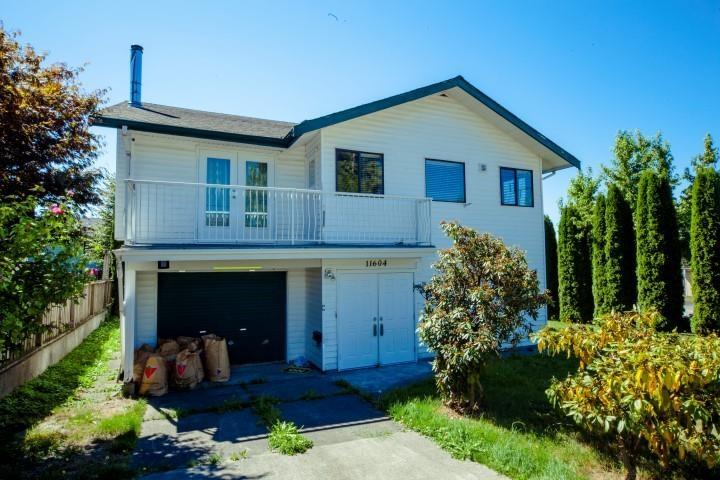 A two-story house with a balcony and a garage.