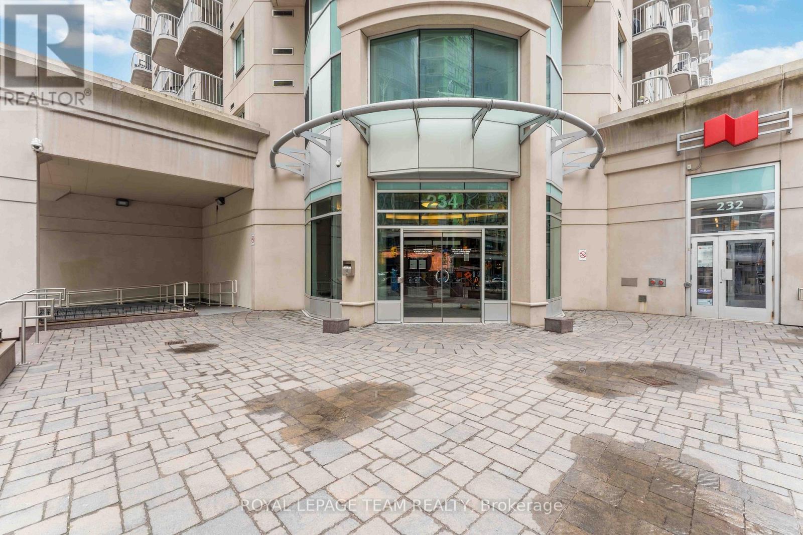 The image shows a building with a large glass entrance and a sign that reads "ROYAL LEPAGE TEAM HEALTH CENTRE".