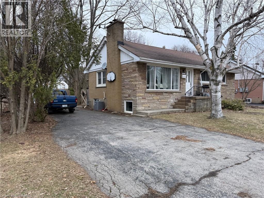 A house with a driveway in front of it.