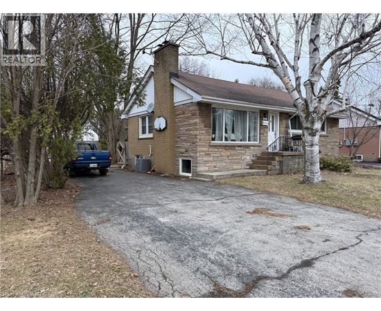 A house with a driveway in front of it.