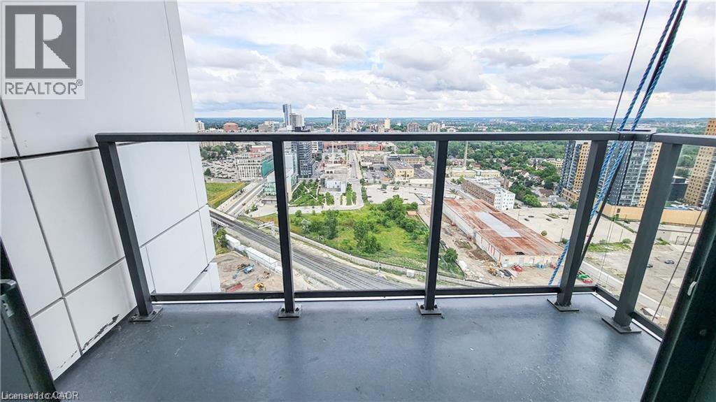 A view from a high-rise building looking out over a cityscape.