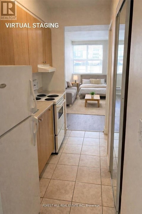 A kitchen with a refrigerator, oven, and sink is shown in a virtual staging.