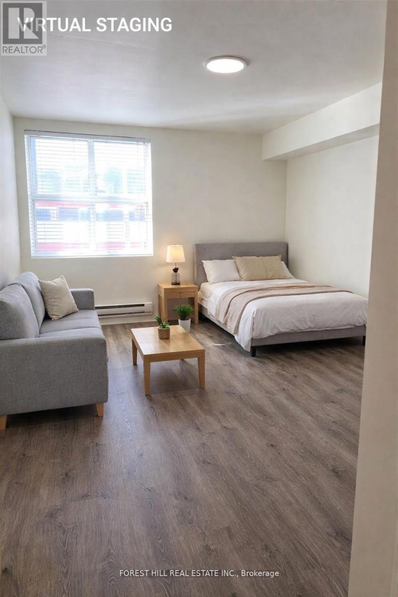 A virtual staging image of a bedroom with a bed, couch, and coffee table.