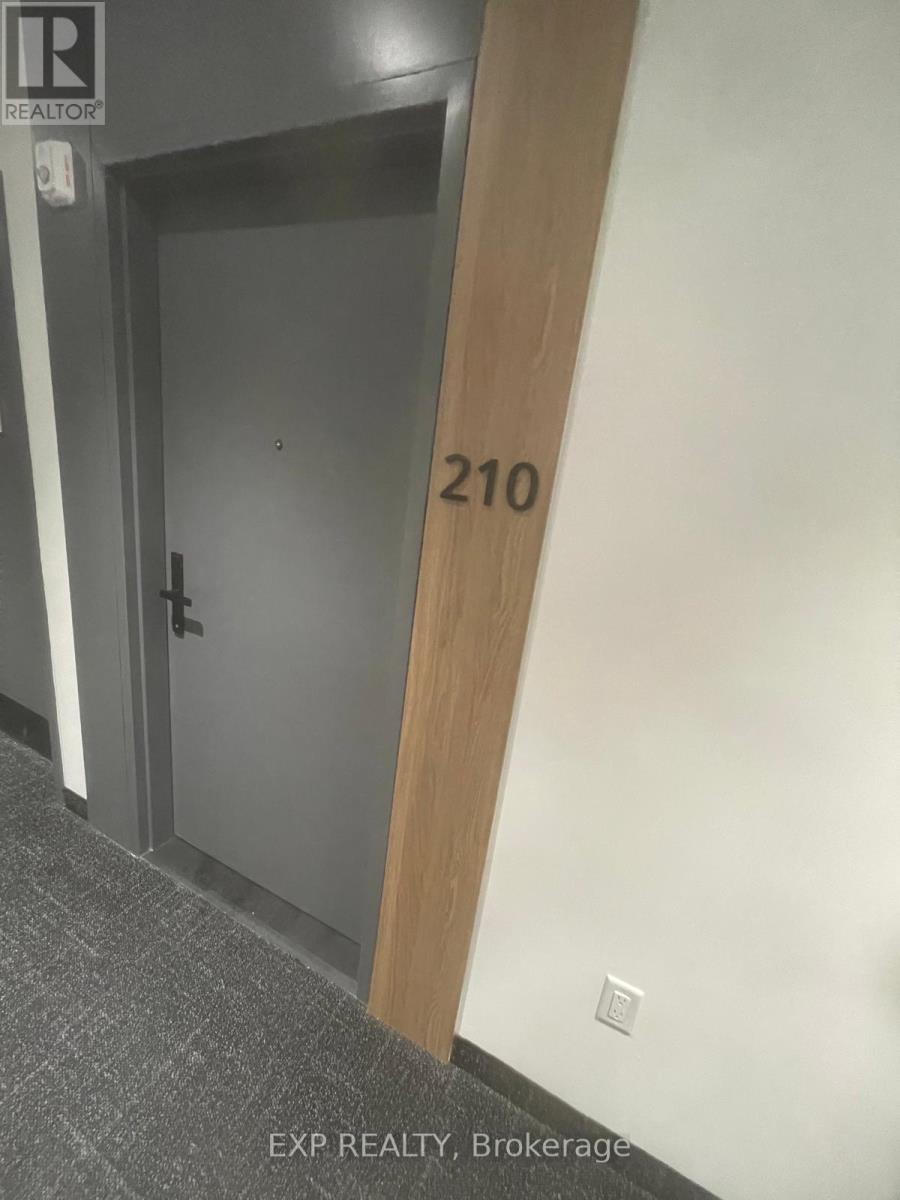 A door with the number 210 on it.