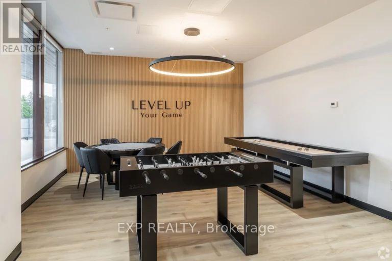 A room with a pool table and a sign that says "LEVEL UP Your Game".