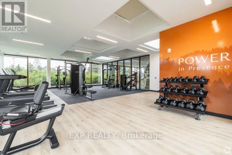 A gym with treadmills, weights and a wall that says "Power in Presence".