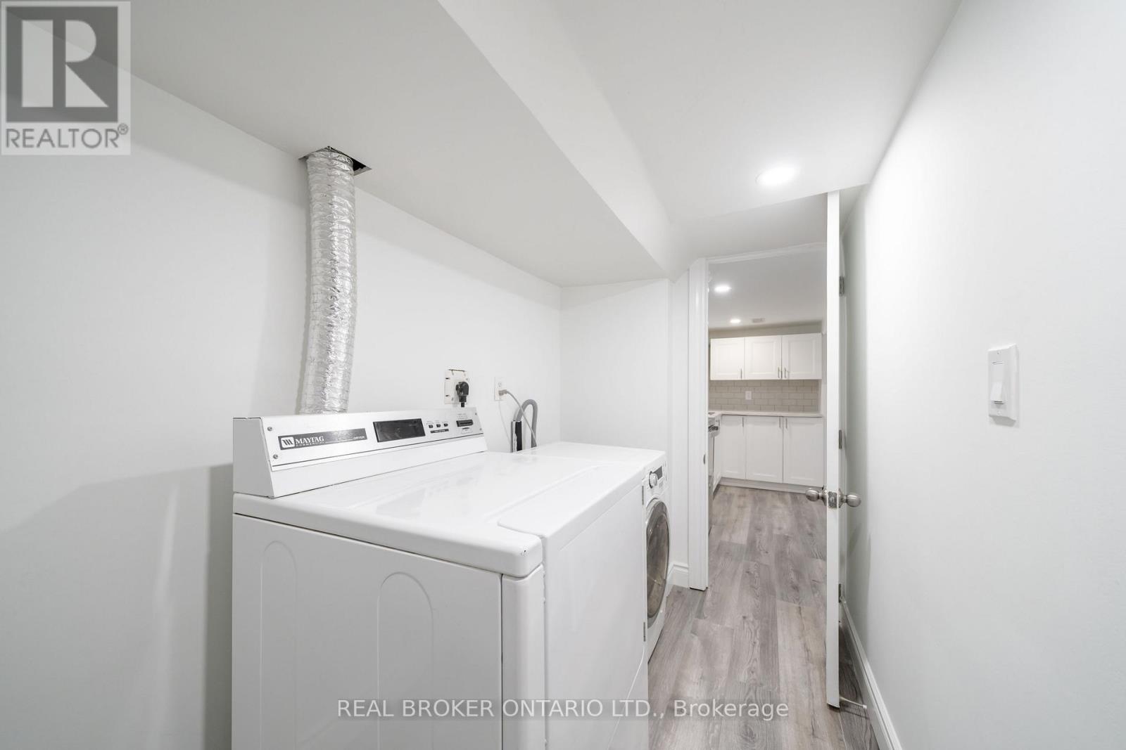 A laundry room with a washer and dryer.