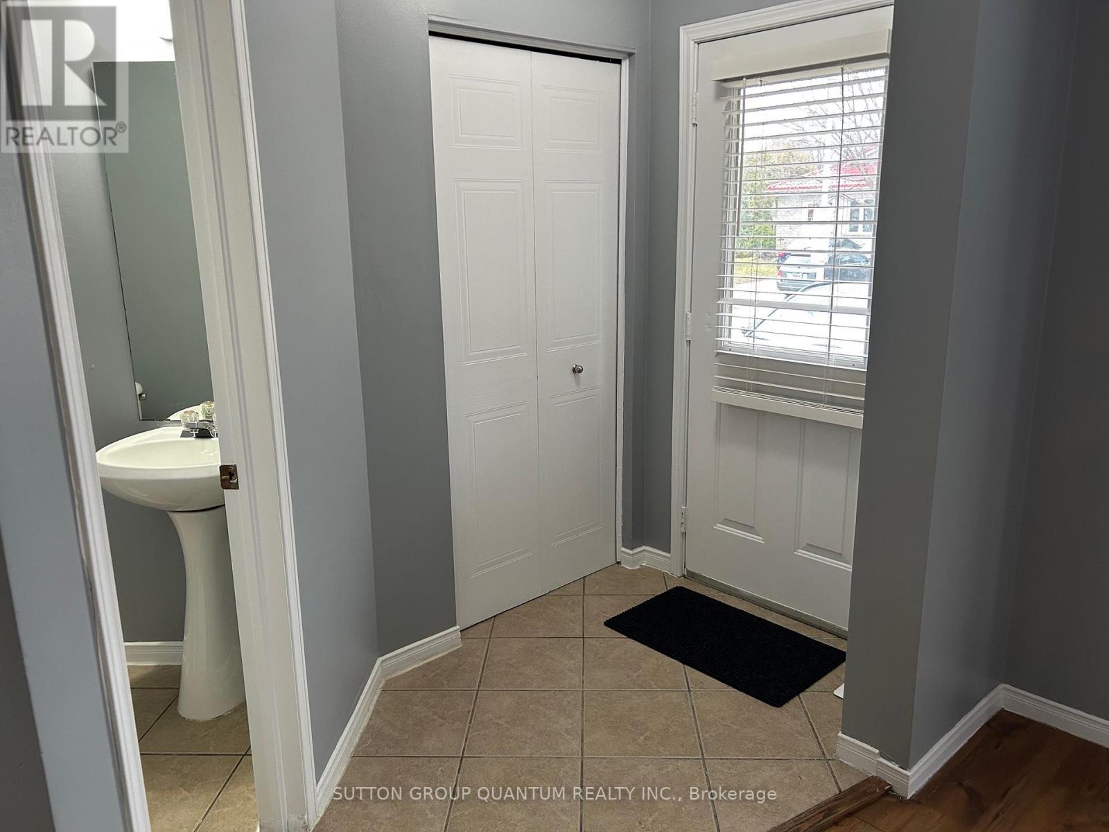 A bathroom with a white toilet and sink.