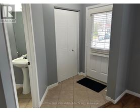 A bathroom with a white toilet and sink.