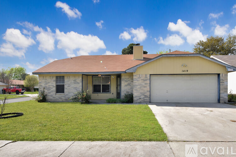 A house with a garage door is for sale.