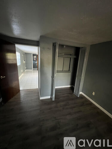 A room with a sliding door and a window.
