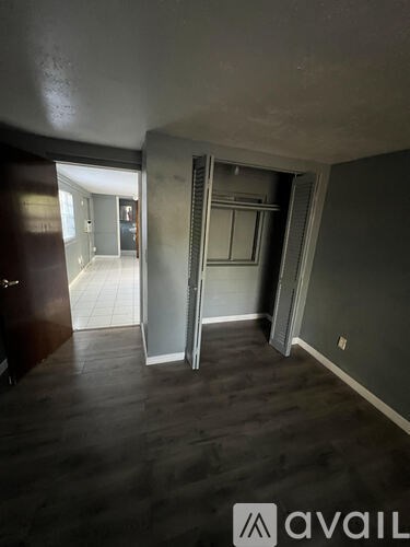 A room with a sliding door and a window.