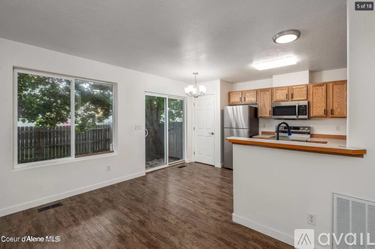 A kitchen with wooden cabinets and a white countertop.