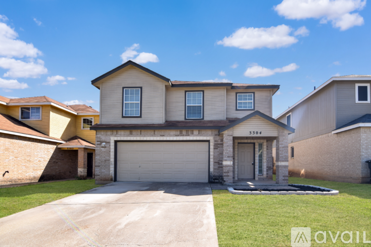 A house with a garage is for sale.