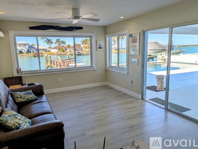 A living room with a view of a marina.