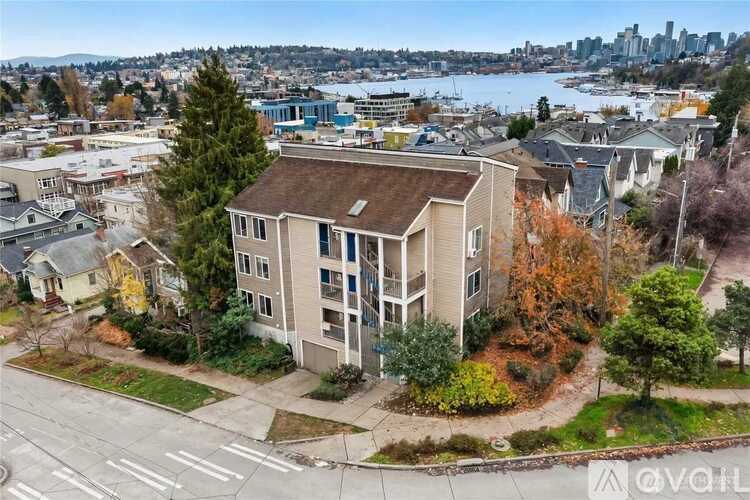Apartment complex with a view of the city and water.