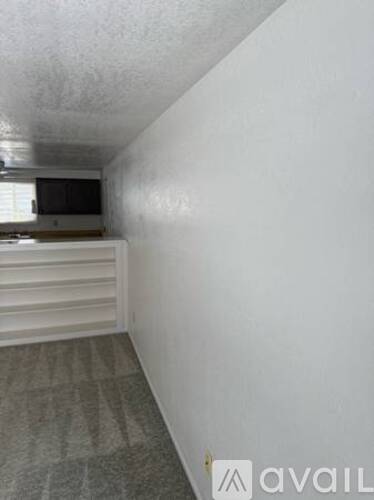A room with a television and a cabinet.