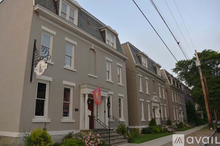 A building with a flag on the front steps.